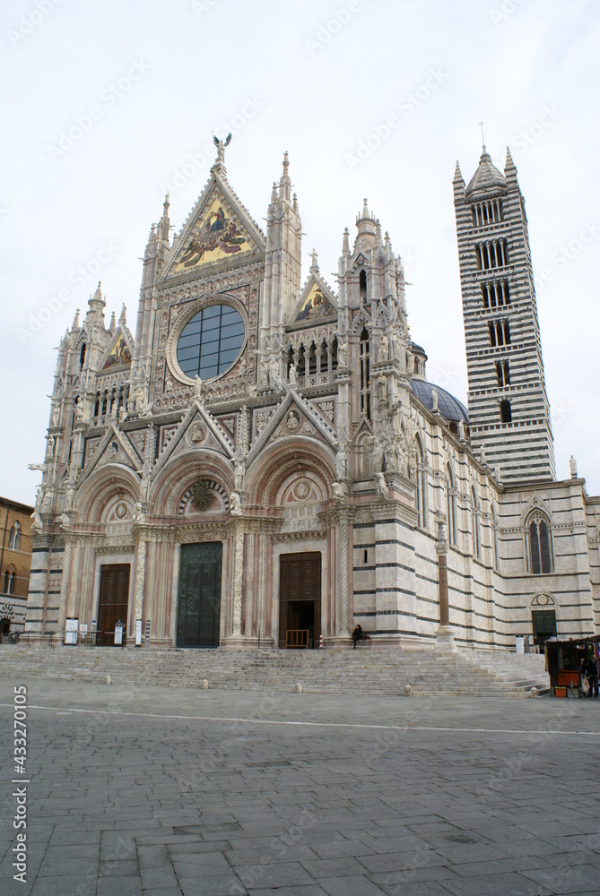 Siena, Tuscany (Italy): facade and bell tower of the famous Gothic cathedral