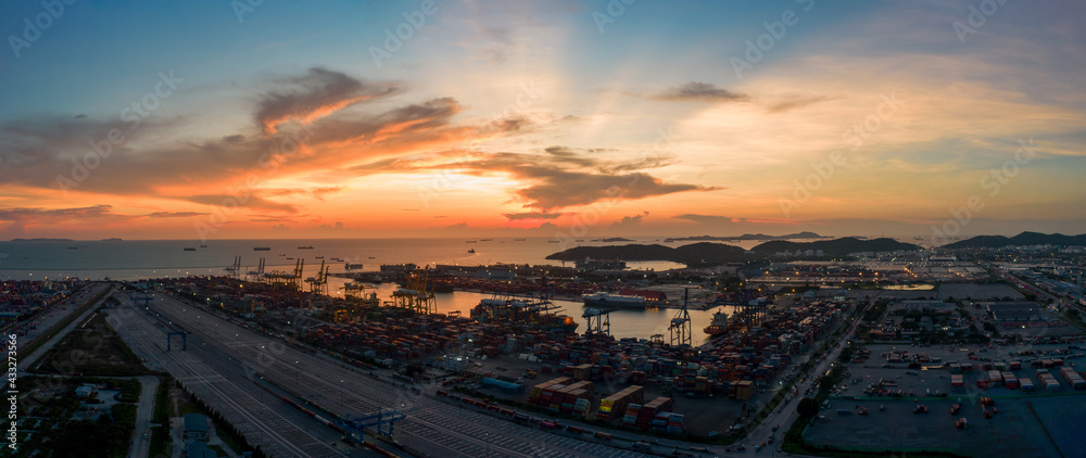 Aerial view of sunset sky at international cargo sea port. Aerial view of sunset sky at international cargo sea port.