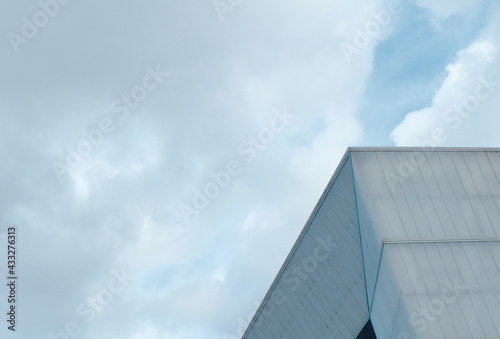 Minimal abstract architectural lines against cloudy sky