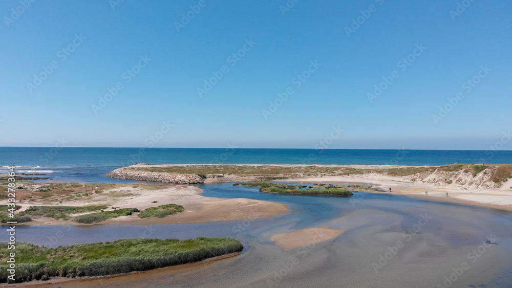DRONE AERIAL VIEW: The mouth and estuary of Neiva River in Castelo do Neiva, Viana do Castelo, Portugal. DRONE AERIAL VIEW: The mouth and estuary of Neiva River in Castelo do Neiva, Viana do Castelo, Portugal.