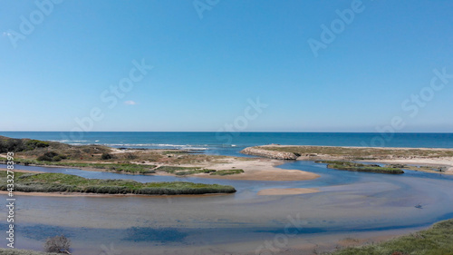 DRONE AERIAL VIEW: The mouth and estuary of Neiva River in Castelo do Neiva, Viana do Castelo, Portugal.