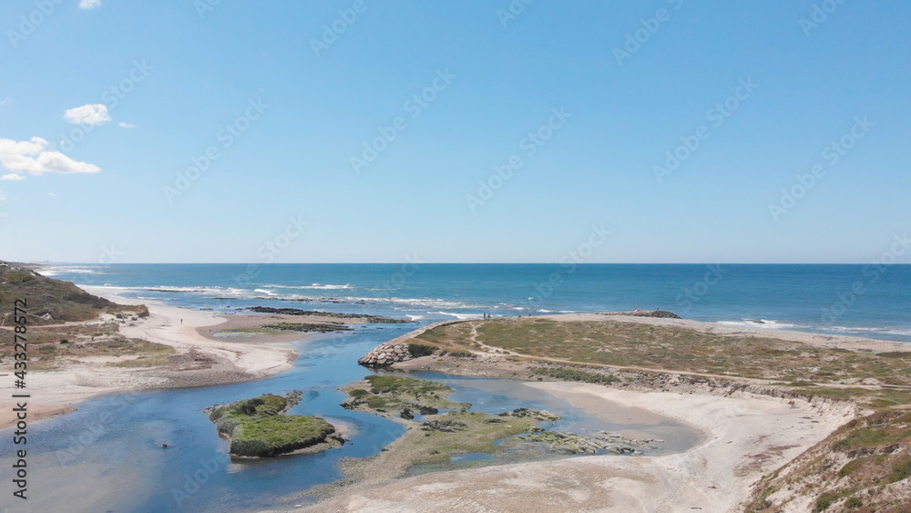 DRONE AERIAL VIEW: The mouth and estuary of Neiva River in Castelo do Neiva, Viana do Castelo, Portugal. DRONE AERIAL VIEW: The mouth and estuary of Neiva River in Castelo do Neiva, Viana do Castelo, Portugal.