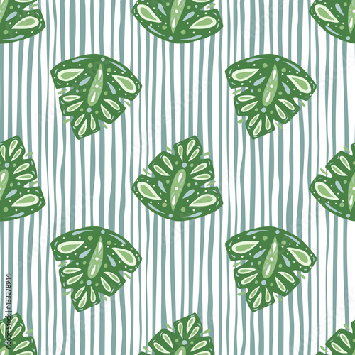Seamless pattern with bright green abstract folk monstera shapes ornament. Blue and white striped background.