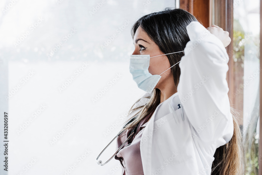 Female medical professional wearing protective face mask during COVID-19 Female medical professional wearing protective face mask during COVID-19