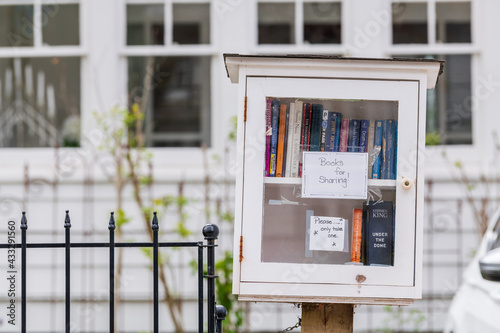 A free book exchange box on a residential  street.