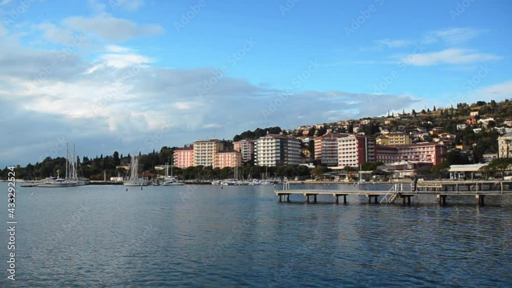 Portorož, Slovenia. 12.04.2020. Picturesque seaside resort town in Slovenian coast against blue sky in winter. Scenic view to Adriatic sea. Portorož, Slovenia. 12.04.2020. Picturesque seaside resort town in Slovenian coast against blue sky in winter. Scenic view to Adriatic sea.