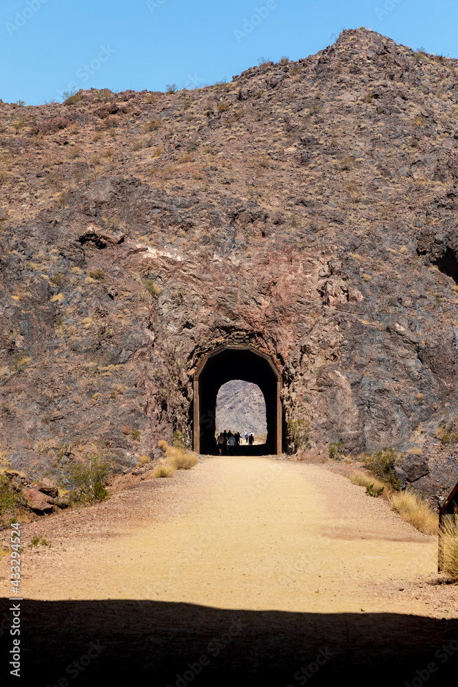 Hikers pass through one of the tunnels of the Hoover Dam Historic