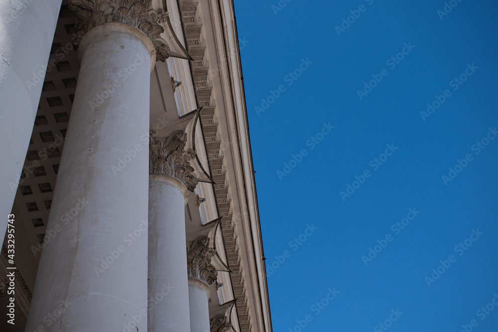 Columns. This photo can be used to show an example of ancient structures, to show the contrast of buildings and the bright blue sky. It will be the perfect background for your desktop.