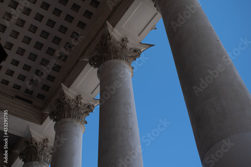 Columns. This photo can be used to show an example of ancient structures, to show the contrast of buildings and the bright blue sky. It will be the perfect background for your desktop.