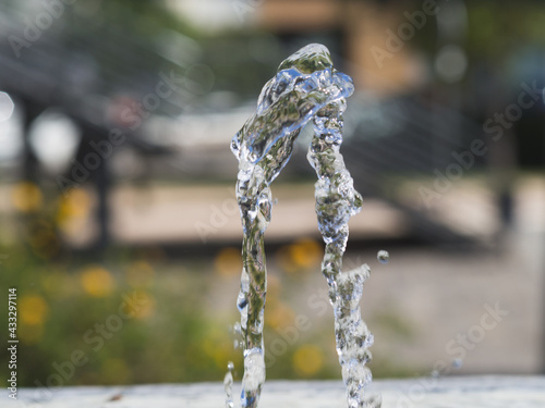 Jet of drinking water from a fountain with copy space.