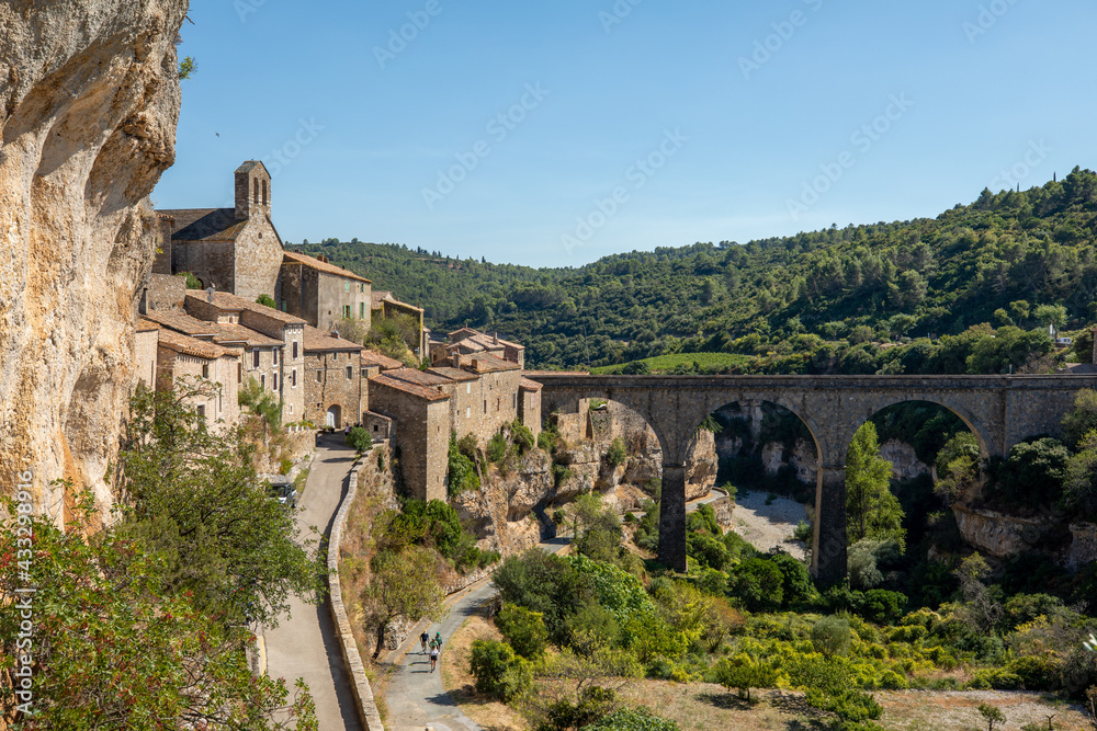 Old stone bridge in the French village of Minerve over the river Cesse.