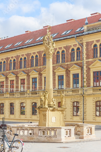 Trinity Column and high school in Main Square, Keszthely, Lake Balaton, Hungary, Europe