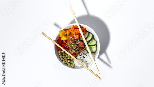 Traditional homemade asian salmon poke bowl with fresh vegetables. Healthy food