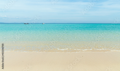 Soft blue ocean wave on clean sandy beach  © กรบุรษ วรดี