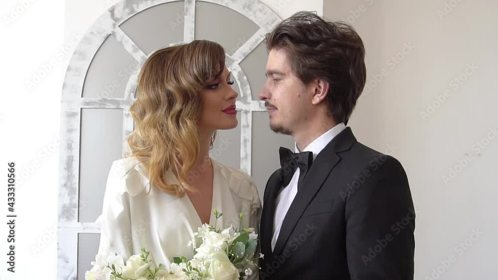 Slow Motion Bride and groom in very bright room Looks each other Slow Motion Bride and groom in very bright room Looks each other