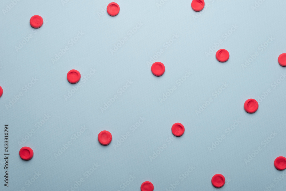 medical flatlay erythrocytes on a blue background.