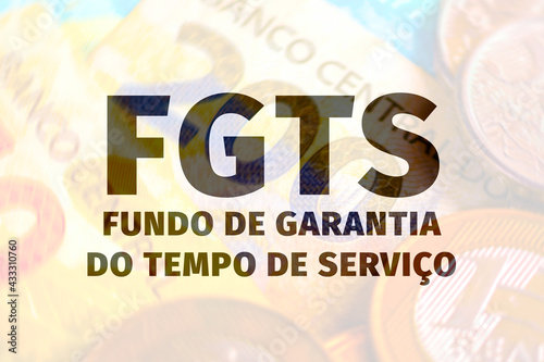 FGTS, Fundo de Garantia do Tempo de Serviço. Background text with money. photo