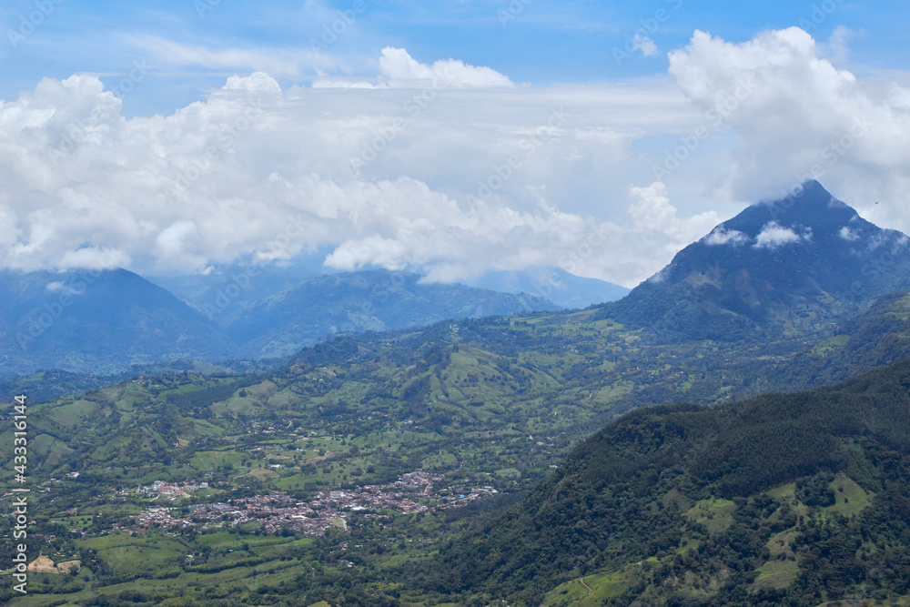 Day landscape photo of colombian and antioquenian green mountains from venice accompanied by clouds and blue sky