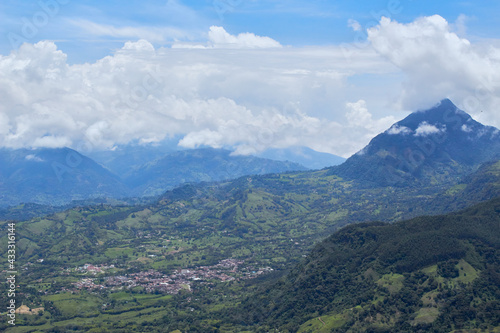 Day landscape photo of colombian and antioquenian green mountains from venice accompanied by clouds and blue sky