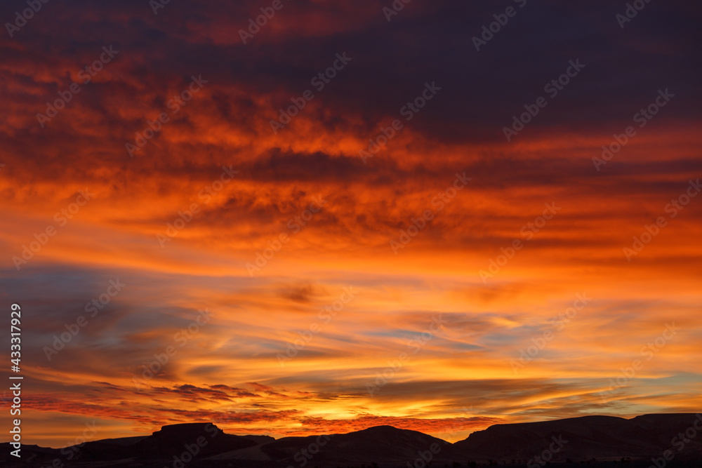 Colorful sky during sunset in the Sahara Desert. Morocco. Beautiful red sky.