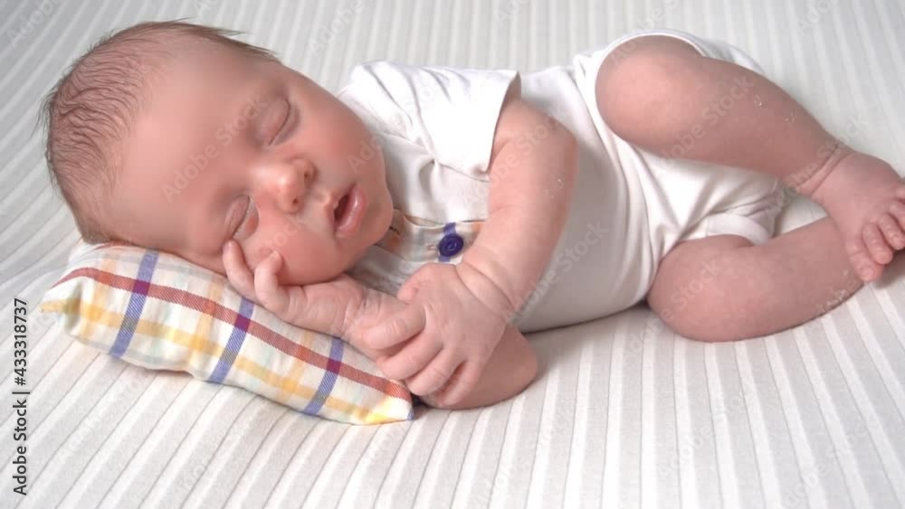 Slow Motion Charming newborn sleeping on tiny pillow Slow Motion Charming newborn sleeping on tiny pillow