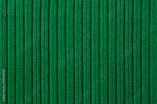 Knitted texture green close up, background