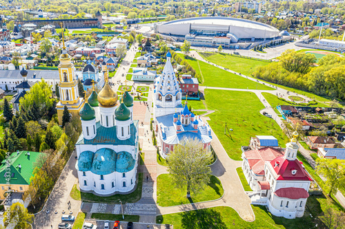 Aerial drone cityscape view of churches and other Orthodox architecture in the old city center of Kolomna, Moscow region, Russia. Assumption Cathedral, Tikhvin Church and Speed Skating Center