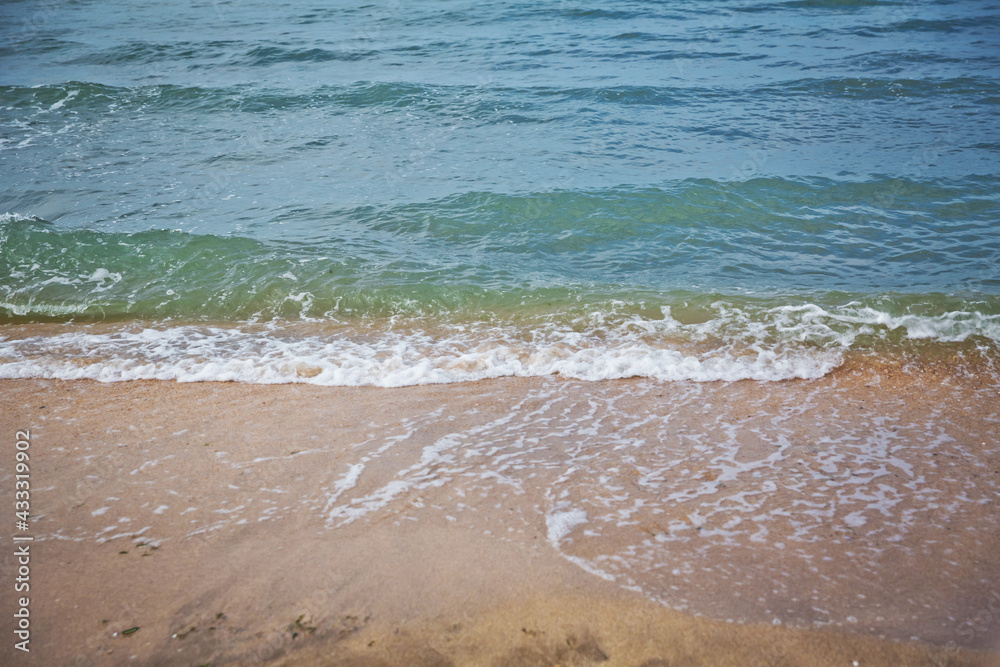Clean and relaxing sea wave splashes over seashore. Idyllic seascape for beach wedding or honeymoon. Exotic seaside banner . Caspian Sea sea water over white sand beach.