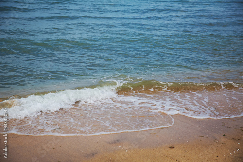 Clean and relaxing sea wave splashes over seashore. Idyllic seascape for beach wedding or honeymoon. Exotic seaside banner . Caspian Sea sea water over white sand beach.