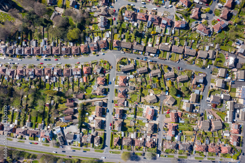 Straight down aerial photo of the British town of Meanwood in Leeds West Yorkshire showing typical UK housing estates and rows of houses in the spring time on a sunny day