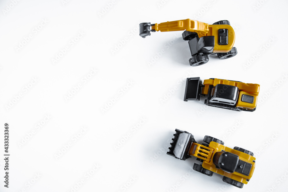 bulldozers and the equator are located on the side on a white background. bulldozers and the equator are located on the side on a white background.