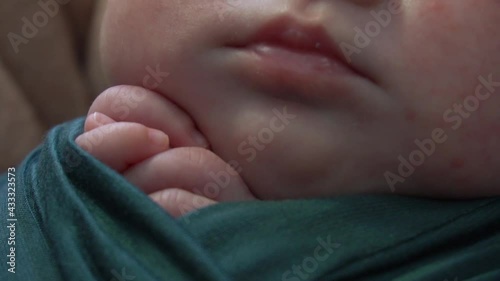 Closeup portrait of Newborn baby on blanket. Soft focus. A two weeks old infant 