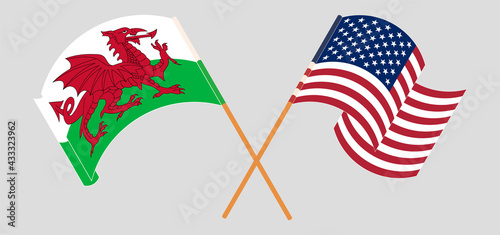 Crossed and waving flags of Wales and the USA