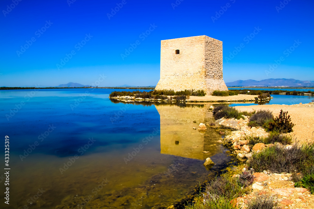 Tamarit tower surrounded by salt lagoons in Santa Pola