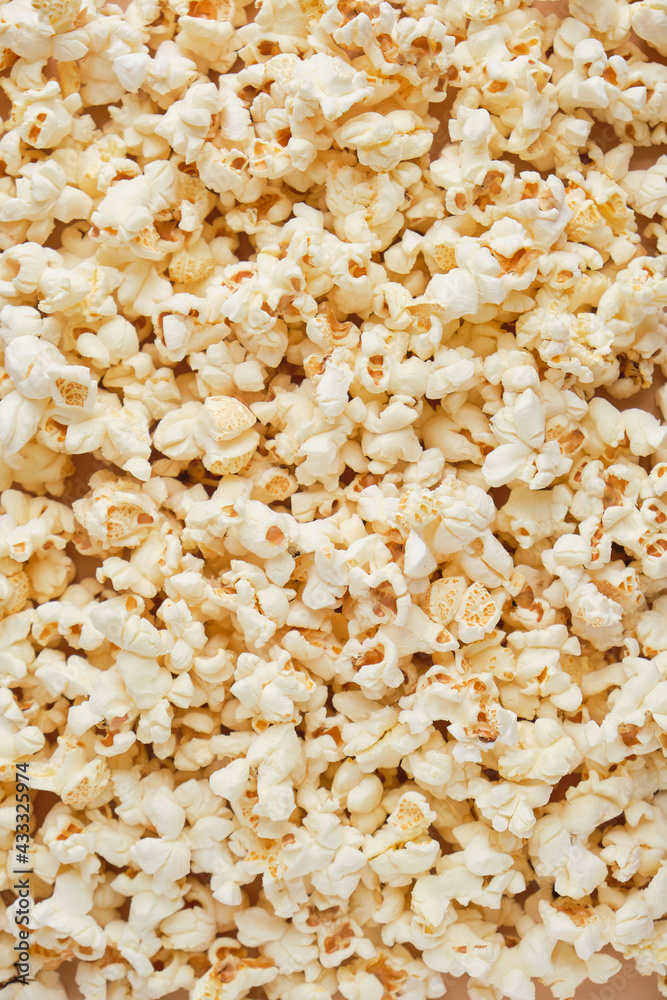 Yellow movie style popcorn background, texture. Lot of popcorn Yellow movie style popcorn background, texture. Lot of popcorn