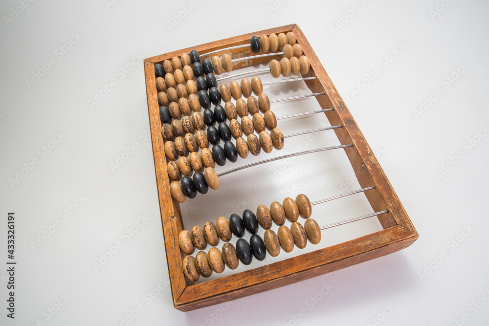 Old wooden abacus on pure white background Old wooden abacus on pure white background