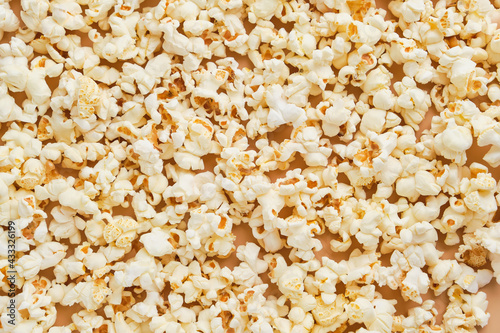 Yellow movie style popcorn background, texture. Lot of popcorn