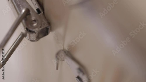 Close up metal lock on latches opens on the door of a cedar phyto barrel