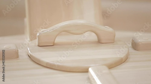 Closeup of wooden lid with handles and metal door hinges of cedar phyto-barrel