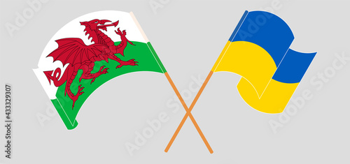 Foto Crossed and waving flags of Wales and Ukraine