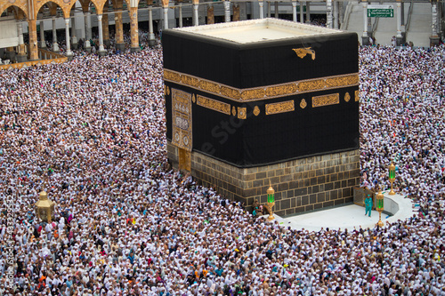 The Holy Kaaba is the center of Islam. Masjid Al Haram in Mecca. Crowd of people always walking around Kaaba. Tawaf