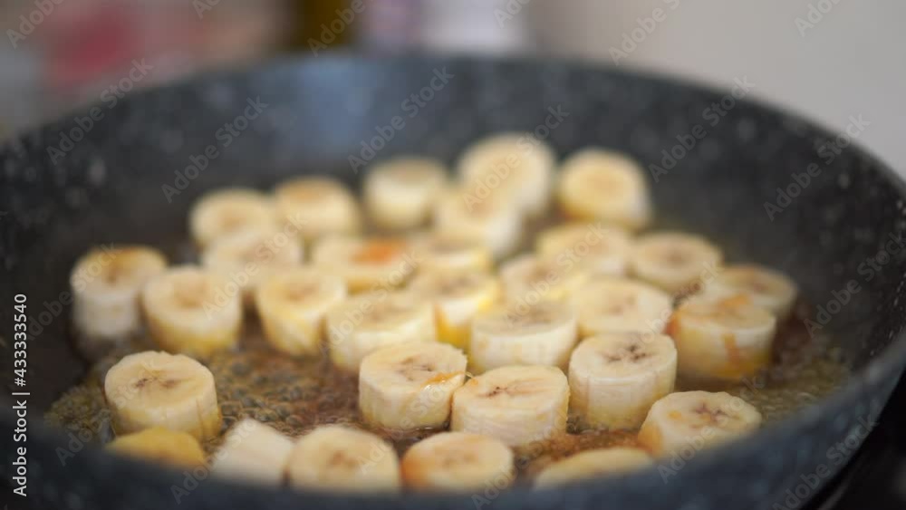 Process of cooking caramelized banana in a frying pan at home Selective focus Healthy Process of cooking caramelized banana in a frying pan at home Selective focus Healthy
