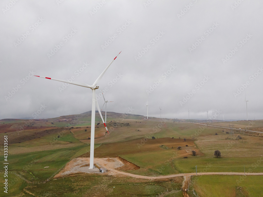 Fototapeta premium Electricity Wind turbine landscape. Wind farm energy eco friendly in mountains. Renewable clean energy production