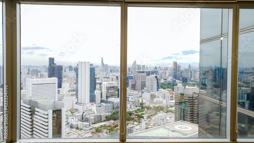 Office building window interior deign with modern city skyline background, Beautiful real estate building and skyscrapers in Bangkok Thailand