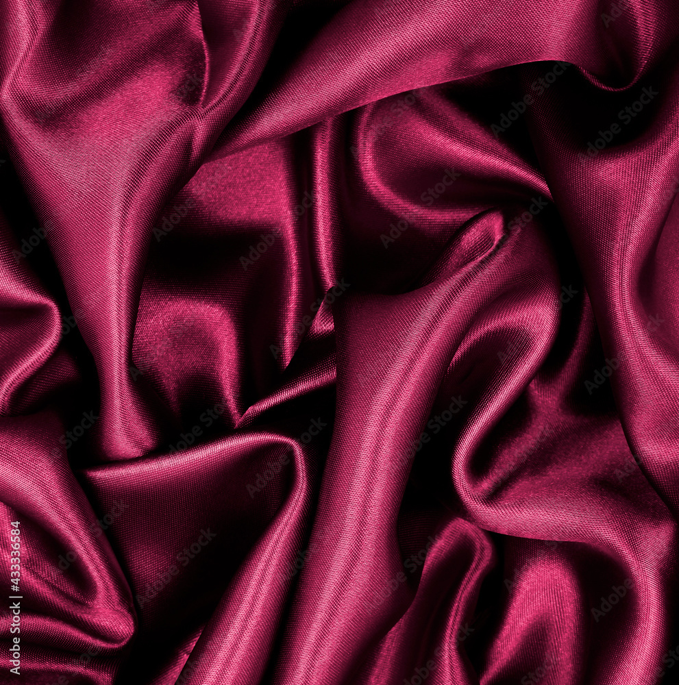 Obraz premium Smooth elegant pink silk or satin luxury cloth texture as abstract background. Luxurious background design