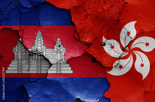 flags of Cambodia and Hong Kong painted on cracked wall photo