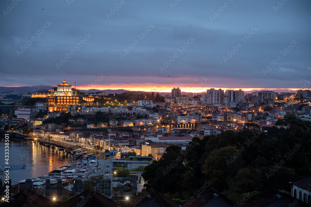 Panoramic view on Douro river and old part of Porto city in Portugal at night