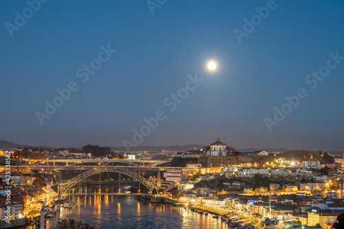 Fototapeta Naklejka Na Ścianę i Meble -  Panoramic view on Douro river and old part of Porto city in Portugal at night