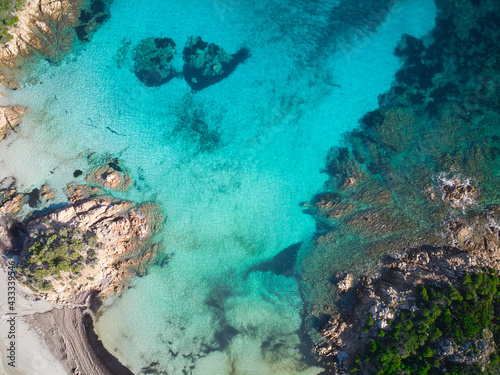 View from above, stunning aerial view of the Prince Beach (Spiaggia del Principe) bathed by a beautiful turquoise sea. Costa Smeralda (Emerald Coast)