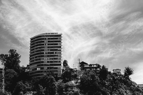 Buildings and houses in a hill and beautiful sky with clouds, Valparaiso, Chile (in black and white)